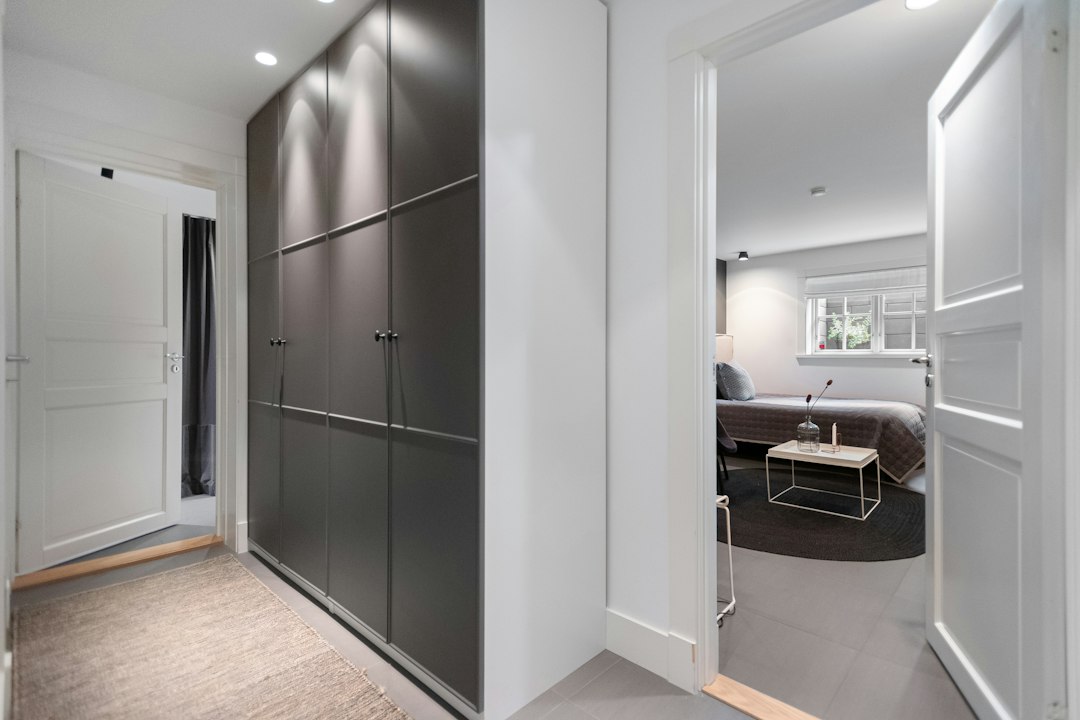 Photo asymmetrical track lighting walk-in closet